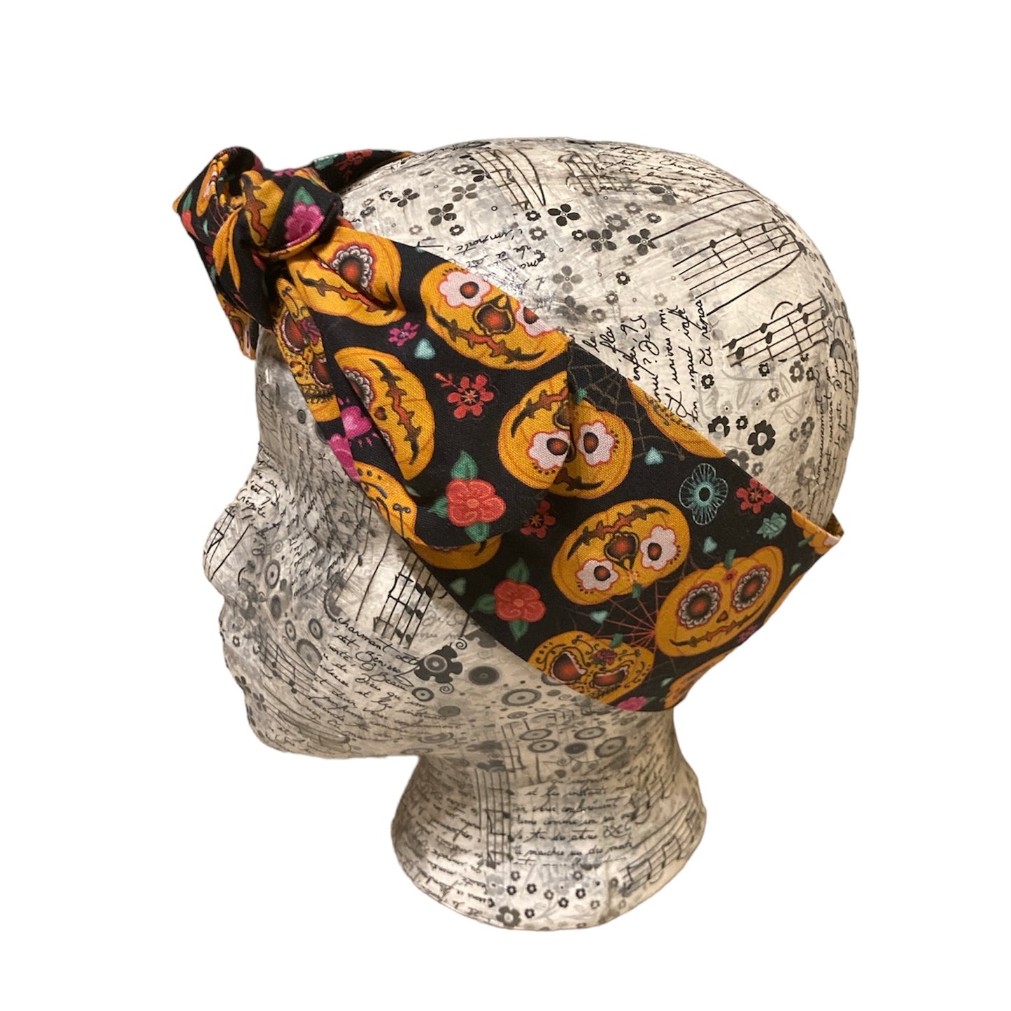Decorated pumpkins on black headband
