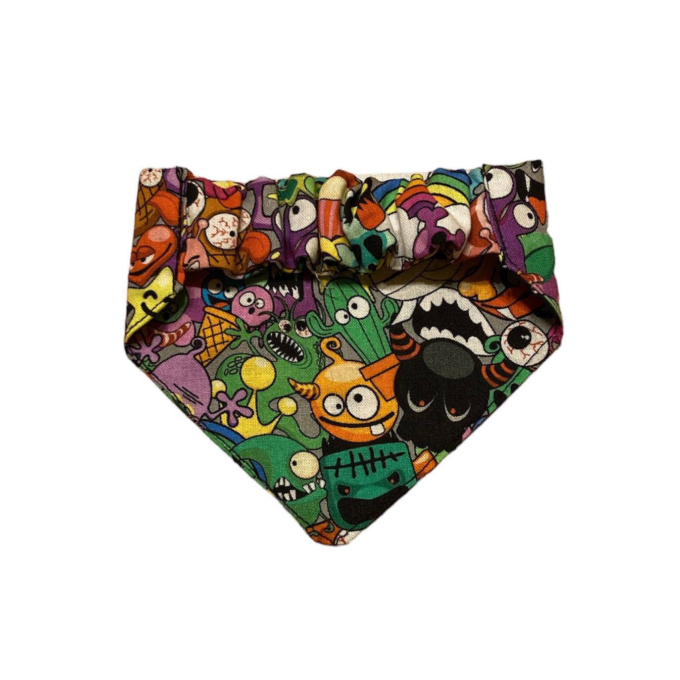 back of cat bandana in colourful cartoon monster print. shows elasticated strap.
